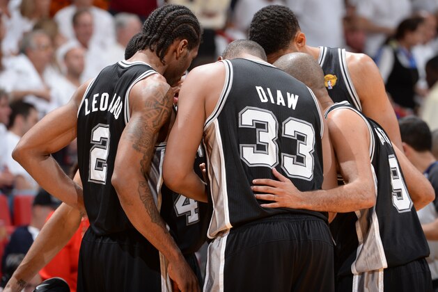 MIAMI, FL - JUNE 10: Kawhi Leonard #2, Danny Green #4, Boris Diaw #33, Tony Parker #9 and Tim Duncan #21 of the San Antonio Spurs huddle during Game Three of the 2014 NBA Finals between the Miami Heat and San Antonio Spurs at the American Airlines Arena on June 10, 2014 in Miami, Florida. NOTE TO USER: User expressly acknowledges and agrees that, by downloading and/or using this photograph, user is consenting to the terms and conditions of the Getty Images License Agreement. Mandatory Copyright Notice: Copyright 2014 NBAE (Photo by Andrew D Bernstein/NBAE via Getty Images) MIAMI, FL - JUNE 10: Kawhi Leonard #2, Danny Green #4, Boris Diaw #33, Tony Parker #9 and Tim Duncan #21 of the San Antonio Spurs huddle during Game Three of the 2014 NBA Finals between the Miami Heat and San Antonio Spurs at the American Airlines Arena on June 10, 2014 in Miami, Florida. NOTE TO USER: User expressly acknowledges and agrees that, by downloading and/or using this photograph, user is consenting to the terms and conditions of the Getty Images License Agreement. Mandatory Copyright Notice: Copyright 2014 NBAE (Photo by Andrew D Bernstein/NBAE via Getty Images)