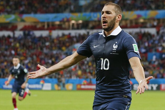 France's Karim Benzema celebrates after scoring his side's third goal during the group E World Cup soccer match between France and Honduras at the Estadio Beira-Rio in Porto Alegre, Brazil, Sunday, June 15, 2014. (AP Photo/Jon Super)