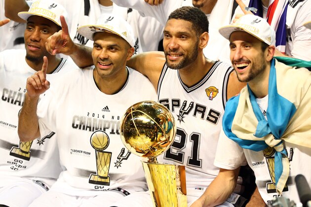 SAN ANTONIO, TX - JUNE 15:  The San Antonio Spurs celebrate with the Larry O'Brien trophy after defeating the Miami Heat to win the 2014 NBA Finals at the AT&T Center on June 15, 2014 in San Antonio, Texas. NOTE TO USER: User expressly acknowledges and agrees that, by downloading and or using this photograph, User is consenting to the terms and conditions of the Getty Images License Agreement.  (Photo by Andy Lyons/Getty Images)