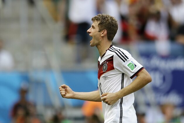 Germany's Thomas Mueller runs off the pitch during the second half after scoring his side's fourth goal during the group G World Cup soccer match between Germany and Portugal at the Arena Fonte Nova in Salvador, Brazil, Monday, June 16, 2014.  (AP Photo/Natacha Pisarenko)