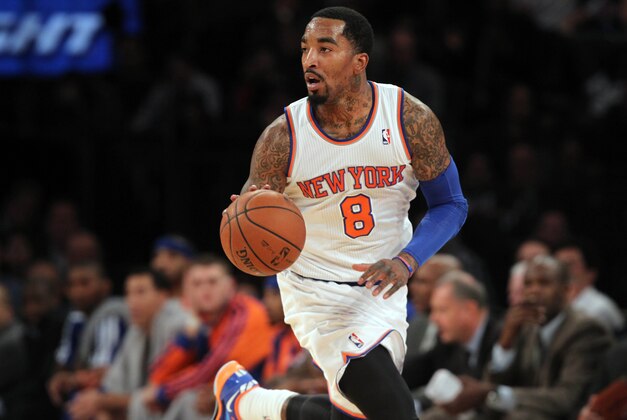 Nov 20, 2013; New York, NY, USA; New York Knicks shooting guard J.R. Smith (8) controls the ball against the Indiana Pacers during the second quarter at Madison Square Garden. The Pacers defeated the Knicks 103-96 in overtime. Mandatory Credit: Brad Penner-USA TODAY Sports