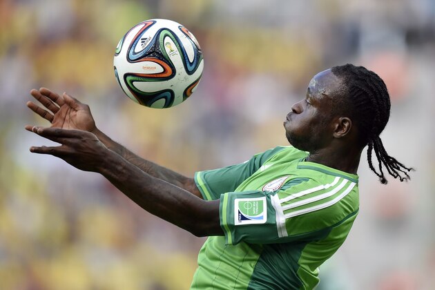 Nigeria's Victor Moses controls the ball during the group F World Cup soccer match between Iran and Nigeria at the Arena da Baixada in Curitiba, Brazil, Monday, June 16, 2014.  (AP Photo/Martin Meissner)