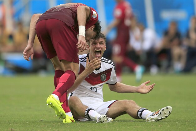 Portugal's Pepe , left, puts his head on Germany's Thomas Mueller during the group G World Cup soccer match between Germany and Portugal at the Arena Fonte Nova in Salvador, Brazil, Monday, June 16, 2014.  Pepe was red carded after this.  (AP Photo/Bernat Armangue)