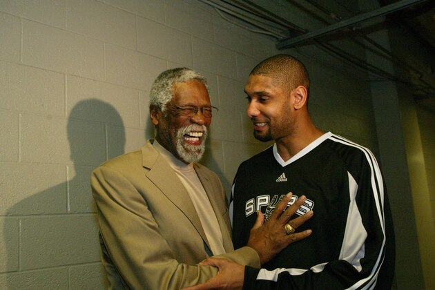 PHOENIX - FEBRUARY 14: NBA Legend Bill Russell and Tim Duncan #21 of the San Antonio Spurs share a laugh prior to the Haier Shooting Stars competition as part of 2009 NBA All-Star Weekend at US Airways Center on February 14, 2009  in Phoenix, Arizona.  NOTE TO USER: User expressly acknowledges and agrees that, by downloading and or using this photograph, User is consenting to the terms and conditions of the Getty Images License Agreement. Mandatory Copyright Notice: Copyright 2009 NBAE  (Photo by Ray Amati/NBAE via Getty Images)