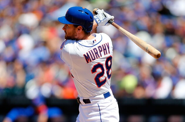NEW YORK, NY - JUNE 15:  Daniel Murphy #28 of the New York Mets follows through on a second inning run scoring sacrifice fly against the San Diego Padres at Citi Field on June 15, 2014 in the Flushing neighborhood of the Queens borough of New York City.  (Photo by Jim McIsaac/Getty Images)