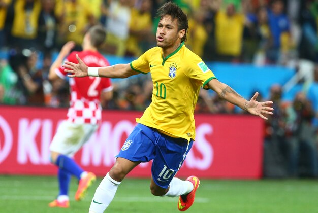 Jun 12, 2014; Sao Paulo, BRAZIL; Brazil forward Neymar (10) celebrates after scoring a goal against Croatia in the first half of the opening game of the 2014 World Cup at Arena Corinthians. Mandatory Credit: Mark J. Rebilas-USA TODAY Sports Jun 12, 2014; Sao Paulo, BRAZIL; Brazil forward Neymar (10) celebrates after scoring a goal against Croatia in the first half of the opening game of the 2014 World Cup at Arena Corinthians. Mandatory Credit: Mark J. Rebilas-USA TODAY Sports