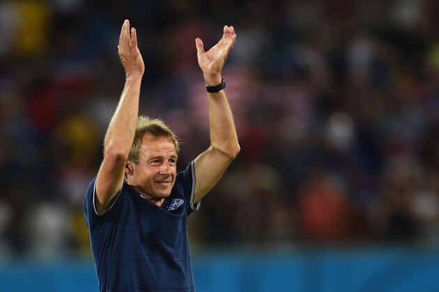 NATAL, BRAZIL - JUNE 16: Head coach Jurgen Klinsmann of the United States acknowledges the fans after defeating Ghana 2-1 during the 2014 FIFA World Cup Brazil Group G match between Ghana and the United States at Estadio das Dunas on June 16, 2014 in Natal, Brazil.  (Photo by Jamie McDonald/Getty Images)