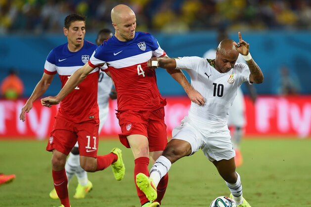 NATAL, BRAZIL - JUNE 16:  Michael Bradley of the United States and Andre Ayew of Ghana battle for the ball during the 2014 FIFA World Cup Brazil Group G match between Ghana and the United States at Estadio das Dunas on June 16, 2014 in Natal, Brazil.  (Photo by Jamie McDonald/Getty Images)