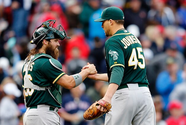 BOSTON, MA - MAY 4: Jim Johnson #45 of the Oakland Athletics celebrates with Derek Norris #36 after defeating the Red Sox 3-2 after ten innings at Fenway Park on May 4, 2014 in Boston, Massachusetts.  (Photo by Jim Rogash/Getty Images)