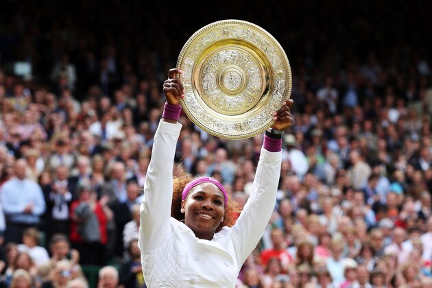 LONDON, ENGLAND - JULY 07:  Serena Williams of the USA lifts the winners trophy and celebrates after her Ladies’ Singles final match against Agnieszka Radwanska of Poland on day twelve of the Wimbledon Lawn Tennis Championships at the All England Lawn Tennis and Croquet Club on July 7, 2012 in London, England.  (Photo by Julian Finney/Getty Images)