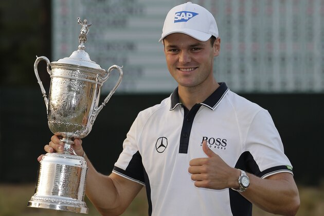Martin Kaymer, of Germany, poses with the trophy after wining the U.S. Open golf tournament in Pinehurst, N.C., Sunday, June 15, 2014.  (AP Photo/Eric Gay)