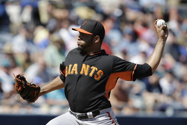San Francisco Giants starting pitcher Edwin Escobar throws during the first inning of a spring exhibition baseball game against the Seattle Mariners Saturday, March 15, 2014, in Peoria, Ariz. (AP Photo/Darron Cummings)