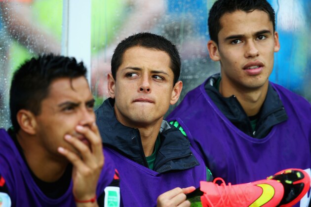 NATAL, BRAZIL - JUNE 13: Javier Hernandez of Mexico looks on from the bench during the 2014 FIFA World Cup Brazil Group A match between Mexico and Cameroon at Estadio das Dunas on June 13, 2014 in Natal, Brazil.  (Photo by Julian Finney/Getty Images)