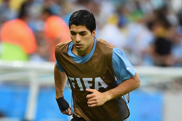 FORTALEZA, BRAZIL - JUNE 14:  Luis Suarez of Uruguay warms up on the sideline during the 2014 FIFA World Cup Brazil Group D match between Uruguay and Costa Rica at Castelao on June 14, 2014 in Fortaleza, Brazil.  (Photo by Laurence Griffiths/Getty Images)