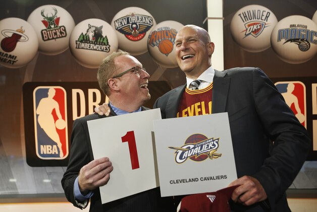 Cleveland Cavaliers general manager David Griffin, left, and minority owner Jeff Cohen celebrate after the Cavaliers won the top pick in the the NBA basketball draft lottery in New York, Tuesday, May 20, 2014. It's the third time in four years the Cavs will be atop the draft after moving up from the ninth spot. (AP Photo/Kathy Willens)