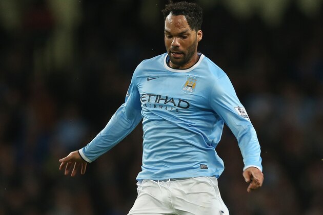 MANCHESTER, ENGLAND - DECEMBER 01:  Joleon Lescott of Manchester City in action during the Barclays Premier League match between Manchester City and Swansea City at the Etihad Stadium on December 1, 2013 in Manchester, England.  (Photo by Clive Brunskill/Getty Images)