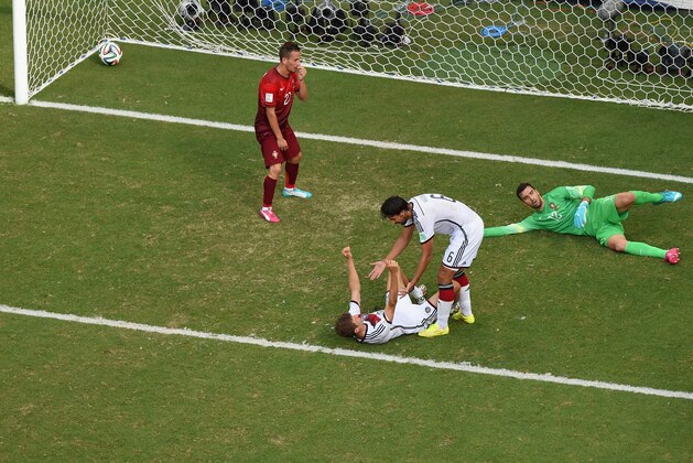 SALVADOR, BRAZIL - JUNE 16:  Thomas Mueller of Germany scores his team's fourth goal and completes his hat trick past Rui Patricio of Portugal during the 2014 FIFA World Cup Brazil Group G match between Germany and Portugal at Arena Fonte Nova on June 16, 2014 in Salvador, Brazil.  (Photo by Pool/Getty Images)