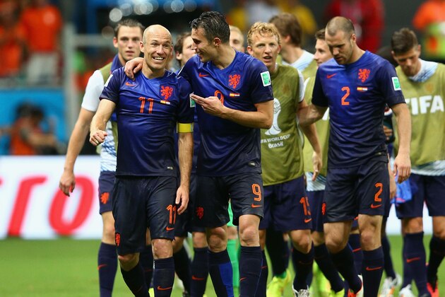 SALVADOR, BRAZIL - JUNE 13:  Arjen Robben and Robin van Persie of the Netherlands celebrate victory after the 2014 FIFA World Cup Brazil Group B match between Spain and Netherlands at Arena Fonte Nova on June 13, 2014 in Salvador, Brazil.  (Photo by Dean Mouhtaropoulos/Getty Images)