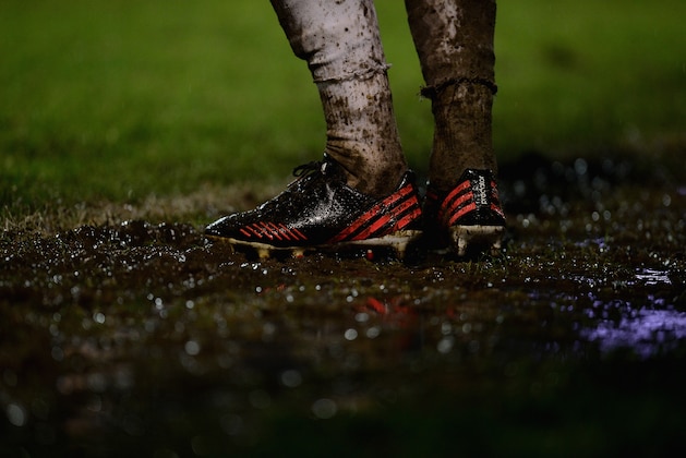 SOUTHEND, ENGLAND - JANUARY 04:  Muddy boots during the FA Cup Third Round match between Southend United and Millwall at Roots Hall on January 4, 2014 in Southend, England.  (Photo by Jamie McDonald/Getty Images)
