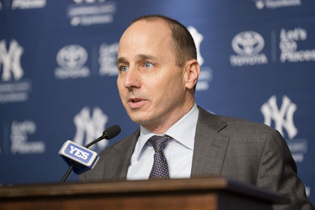 New York Yankees general manager Brian Cashman speaks during a news conference to introduce Carlos Beltran, not pictured, at Yankees Stadium, Friday, Dec. 20, 2013, in New York. Beltran, the former St. Louis Cardinals outfielder, signed with the New York Yankees on a $45 million, three-year contract.(AP Photo/John Minchillo)
