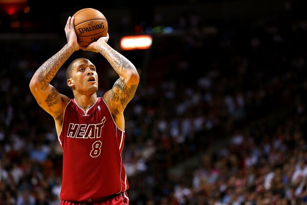 MIAMI, FL - DECEMBER 03:  Michael Beasley #8 of the Miami Heat shoots a free throw during a game against the Detroit Pistons at American Airlines Arena on December 3, 2013 in Miami, Florida. NOTE TO USER: User expressly acknowledges and agrees that, by downloading and/or using this photograph, user is consenting to the terms and conditions of the Getty Images License Agreement. Mandatory copyright notice:  (Photo by Mike Ehrmann/Getty Images)