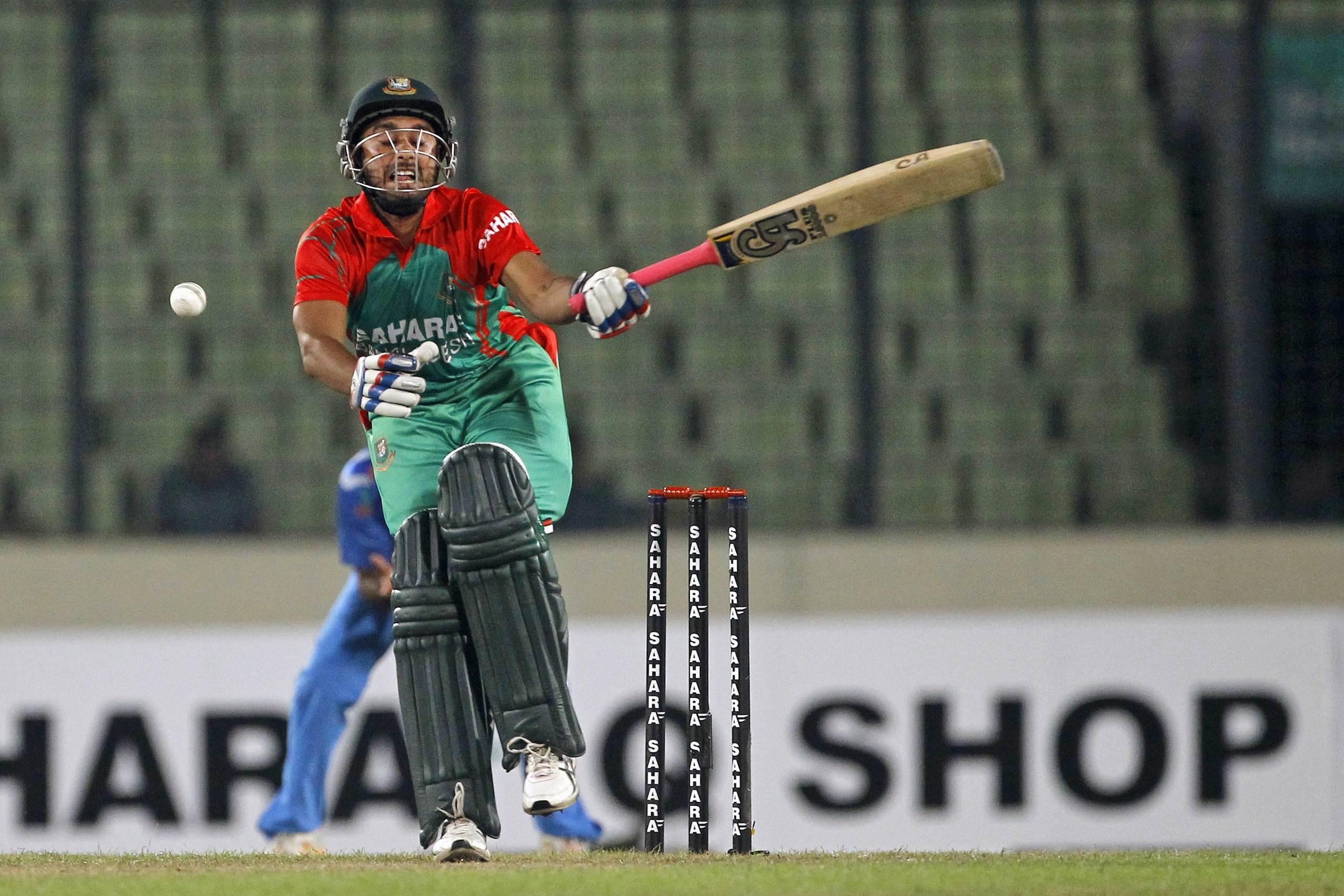 Bangladesh's Mithun Ali reacts after missing a ball during their second one-day International cricket match against India in Dhaka, Bangladesh, Tuesday, June 17, 2014. (AP Photo/A.M. Ahad)