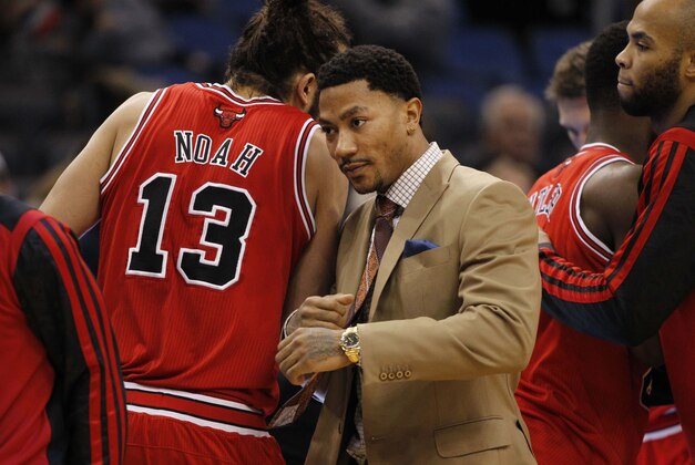 Jan 15, 2014; Orlando, FL, USA; Chicago Bulls point guard Derrick Rose (middle) and center Joakim Noah (13) before the game against the Orlando Magic at Amway Center. Mandatory Credit: Kim Klement-USA TODAY Sports