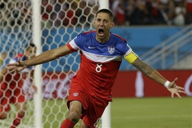United States' Clint Dempsey celebrates after scoring the opening goal during the group G World Cup soccer match between Ghana and the United States at the Arena das Dunas in Natal, Brazil, Monday, June 16, 2014. The United States won the match 2-1. (AP Photo/Ricardo Mazalan)