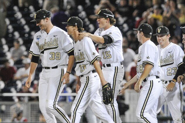 Vanderbilt players from left: Kyle Smith (39), closing pitcher Walker Buehler (13), Carson Fulmer (15), Nolan Rogers (18) and Will Cooper (23) celebrate their 6-4 win over UC Irvine in an NCAA baseball College World Series game in Omaha, Neb., Monday, June 16, 2014. (AP Photo/Eric Francis)
