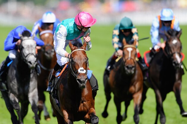 ASCOT, ENGLAND - JUNE 17:  Jockey James Doyle riding Kingman celebrates winning the St James's Palace Stakes during day one of Royal Ascot at Ascot Racecourse on June 17, 2014 in Ascot, England.  (Photo by Alan Crowhurst/Getty Images for Ascot Racecourse)