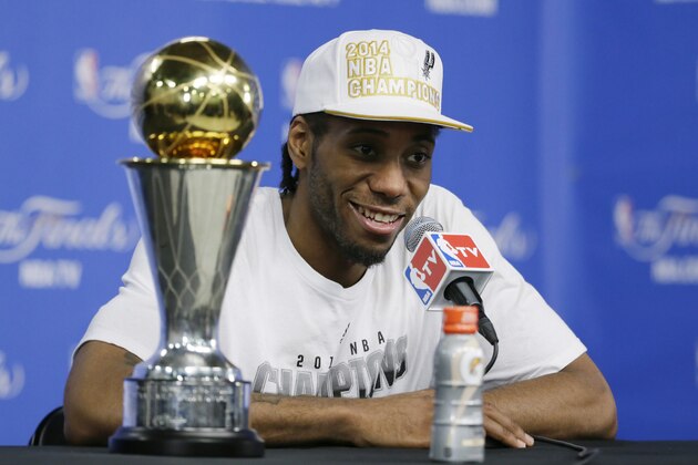 Most Valuable Player San Antonio Spurs forward Kawhi Leonard listens to a question at a news conference after  Game 5 of the NBA basketball finals against the Miami Heat on Sunday, June 15, 2014, in San Antonio. (AP Photo/Tony Gutierrez)