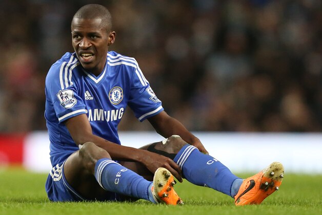 Chelsea's Ramires adjusts his socks after a foul left him on the ground during their English Premier League soccer match between Manchester City and Chelsea at the Etihad Stadium, Manchester, England, Monday Feb. 3, 2014. (AP Photo/Jon Super)