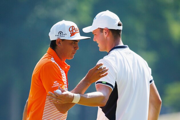 PINEHURST, NC - JUNE 15: (L-R) Rickie Fowler of the United States talks with Martin Kaymer of Germany during the final round of the 114th U.S. Open at Pinehurst Resort & Country Club, Course No. 2 on June 15, 2014 in Pinehurst, North Carolina.  (Photo by Sam Greenwood/Getty Images)
