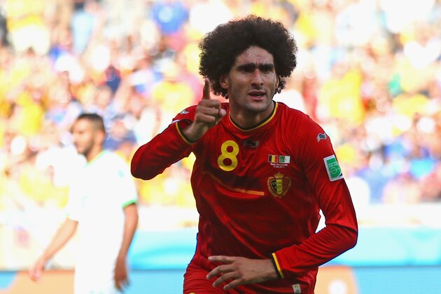 BELO HORIZONTE, BRAZIL - JUNE 17:  Marouane Fellaini of Belgium celebrates scoring his team's first goal during the 2014 FIFA World Cup Brazil Group H match between Belgium and Algeria at Estadio Mineirao on June 17, 2014 in Belo Horizonte, Brazil.  (Photo by Jeff Gross/Getty Images)