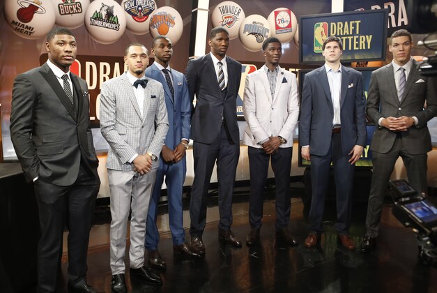 From left, NBA draft prospects Marcus Smart of Oklahoma State, Tyler Ennis of Syracuse, Andrew Wiggins and Joel Embiid of Kansas, Noah Vonleh of Indiana, Doug McDermott of Creighton and Aaron Gordon of Arizona pose for a photograph before the NBA draft lottery in New York, Tuesday, May 20, 2014.  (AP Photo/Kathy Willens)