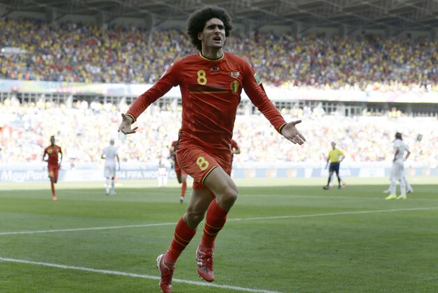 Belgium's Marouane Fellaini celebrates after scoring his side's first goal during the group H World Cup soccer match between Belgium and Algeria at the Mineirao Stadium in Belo Horizonte, Brazil, Tuesday, June 17, 2014.  (AP Photo/Hassan Ammar)