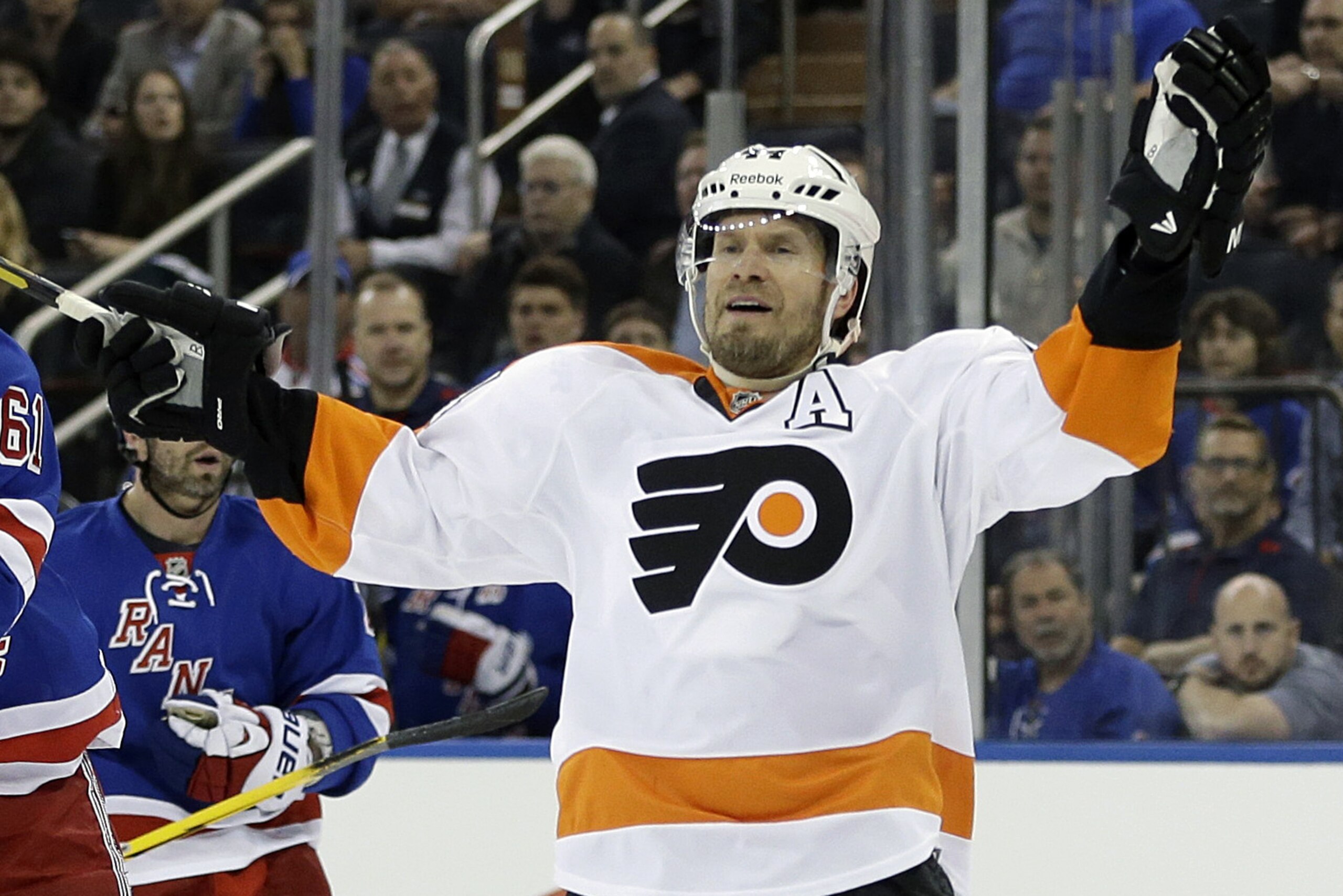 FILE - In this April 27, 2014 file photo, Philadelphia Flyers' Kimmo Timonen, of Finland, reacts during the third period in Game 5 of an NHL hockey first-round playoff series against the New York Rangers, in New York. The Flyers have signed defenseman Timonen to a one-year contract extension. (AP Photo/Seth Wenig, File) FILE - In this April 27, 2014 file photo, Philadelphia Flyers' Kimmo Timonen, of Finland, reacts during the third period in Game 5 of an NHL hockey first-round playoff series against the New York Rangers, in New York. The Flyers have signed defenseman Timonen to a one-year contract extension. (AP Photo/Seth Wenig, File)