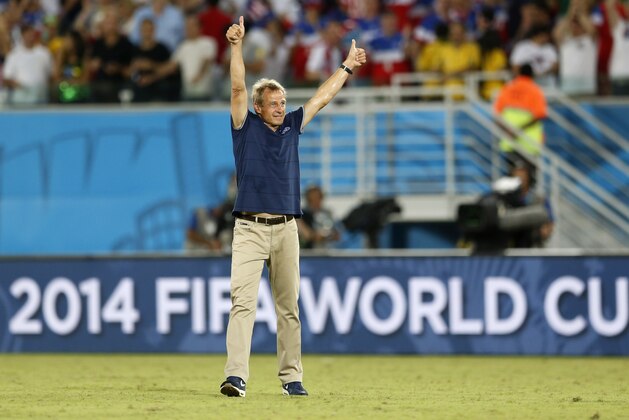 United States' head coach Juergen Klinsmann celebrates after his team's 2-1 victory over Ghana during the group G World Cup soccer match between Ghana and the United States at the Arena das Dunas in Natal, Brazil, Monday, June 16, 2014. (AP Photo/Julio Cortez)