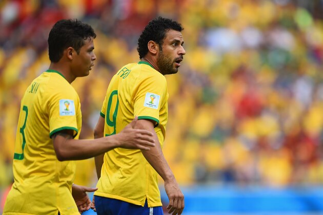 FORTALEZA, BRAZIL - JUNE 17:  Fred of Brazil reacts as Thiago Silva looks on during the 2014 FIFA World Cup Brazil Group A match between Brazil and Mexico at Castelao on June 17, 2014 in Fortaleza, Brazil.  (Photo by Buda Mendes/Getty Images)