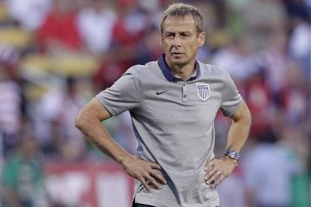 FILE - In this photo taken Tuesday, Sept. 10, 2013, United States manager Jurgen Klinsmann watches his team warm before a World Cup qualifying soccer match against Mexico in Columbus, Ohio.  The United States clinched its seventh straight World Cup appearance, getting second-half goals from Eddie Johnson and Landon Donovan on Tuesday night in a 2-0 win over Mexico. (AP Photo/Jay LaPrete,File)