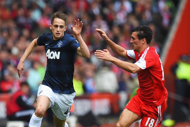 SOUTHAMPTON, ENGLAND - MAY 11:  (L-R) Adnan Januzaj of Manchester United is challenged by Jack Cork of Southampton during the Barclays Premier League match between Southampton and Manchester United at St Mary's Stadium on May 11, 2014 in Southampton, England.  (Photo by Mike Hewitt/Getty Images)