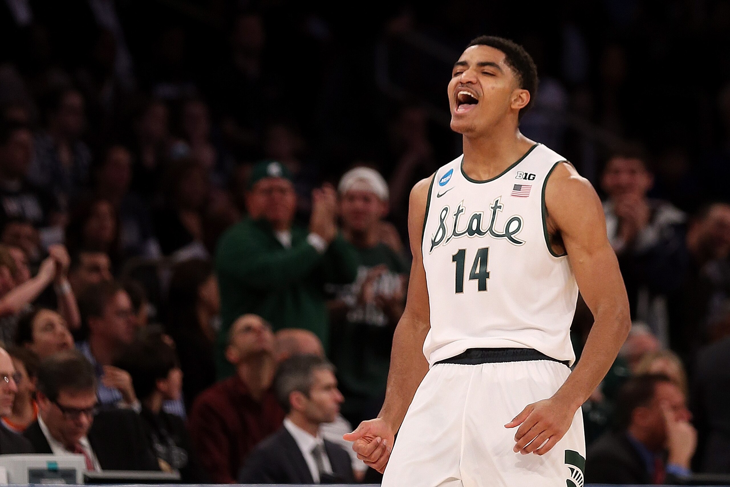 NEW YORK, NY - MARCH 30:  Gary Harris #14 of the Michigan State Spartans reacts after hitting a three pointer late in the first half against the Connecticut Huskies during the East Regional Final of the 2014 NCAA Men's Basketball Tournament at Madison Square Garden on March 30, 2014 in New York City.  (Photo by Bruce Bennett/Getty Images)