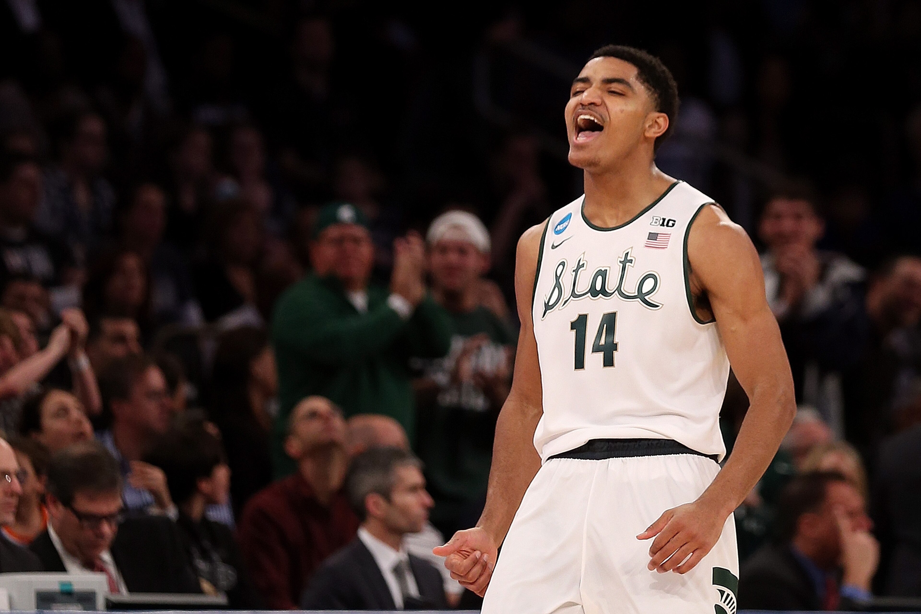 NEW YORK, NY - MARCH 30:  Gary Harris #14 of the Michigan State Spartans reacts after hitting a three pointer late in the first half against the Connecticut Huskies during the East Regional Final of the 2014 NCAA Men's Basketball Tournament at Madison Square Garden on March 30, 2014 in New York City.  (Photo by Bruce Bennett/Getty Images)