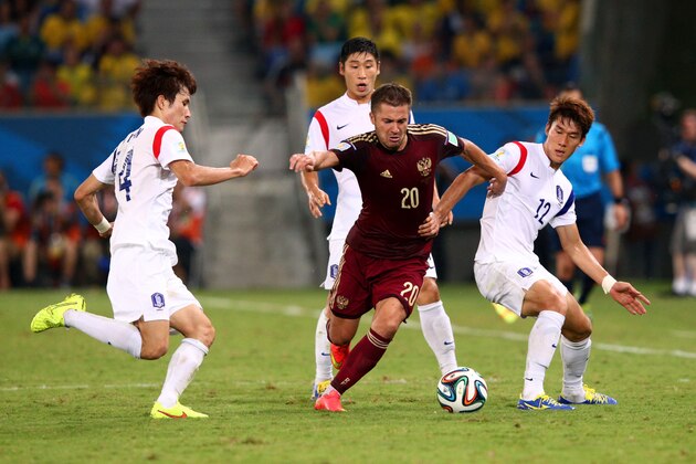 CUIABA, BRAZIL - JUNE 17:  Victor Fayzulin of Russia controls the ball against Han Kook-Young (L) and Lee Yong of South Korea during the 2014 FIFA World Cup Brazil Group H match between Russia and South Korea at Arena Pantanal on June 17, 2014 in Cuiaba, Brazil.  (Photo by Adam Pretty/Getty Images)
