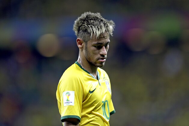 Brazil's Neymar looks down during the group A World Cup soccer match between Brazil and Mexico at the Arena Castelao in Fortaleza, Brazil, Tuesday, June 17, 2014. (AP Photo/Andre Penner)