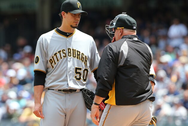 May 18, 2014; Bronx, NY, USA;  Pittsburgh Pirates pitching coach Ray Searage (54) talks to starting pitcher Charlie Morton (50) during the first inning against the New York Yankees at Yankee Stadium. Mandatory Credit: Anthony Gruppuso-USA TODAY Sports