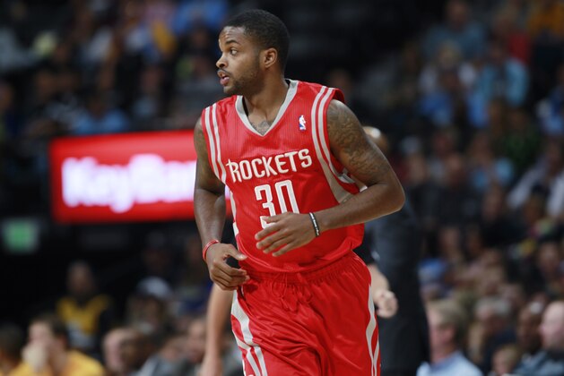 Houston Rockets guard Troy Daniels runs court against the Denver Nuggets in the fourth quarter of the Nuggets' 123-116 victory in an NBA basketball game in Denver on Wednesday, April 9, 2014. (AP Photo/David Zalubowski)