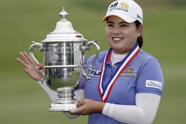 Inbee Park, of South Korea, holds the championship trophy after winning the U.S. Women's Open golf tournament at the Sebonack Golf Club, Sunday, June 30, 2013, in Southampton, N.Y. Park has won the U.S. Women's Open to make history with titles in the year's first three majors. (AP Photo/Frank Franklin II) Inbee Park, of South Korea, holds the championship trophy after winning the U.S. Women's Open golf tournament at the Sebonack Golf Club, Sunday, June 30, 2013, in Southampton, N.Y. Park has won the U.S. Women's Open to make history with titles in the year's first three majors. (AP Photo/Frank Franklin II)