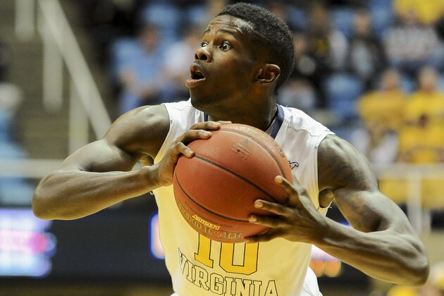 West Virginia's Eron Harris (10) looks to pass during the second half of an NCAA college basketball game against Georgia Southern, Thursday, Nov. 21, 2013, in Morgantown, W.Va. West Virginia won 101-68.  (AP Photo/Andrew Ferguson)
