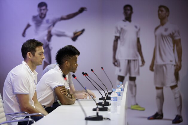 England national soccer team players Raheem Sterling, right, and Frank Lampard answer questions from journalists during a press conference after a squad training session that was closed to the media for the 2014 soccer World Cup at the Urca military base in Rio de Janeiro, Brazil, Tuesday, June 17, 2014.  (AP Photo/Matt Dunham)